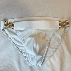 Charlie Greco Brief swimwear, men’s size small, white with gold hardware.